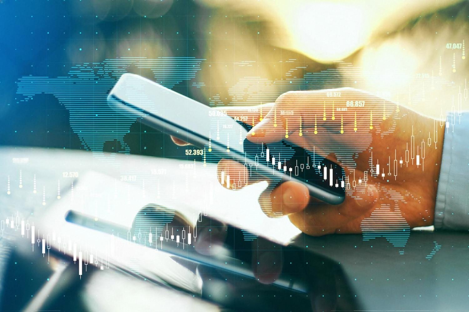 Hand holding a smartphone with a world map and financial data overlay representing international transactions