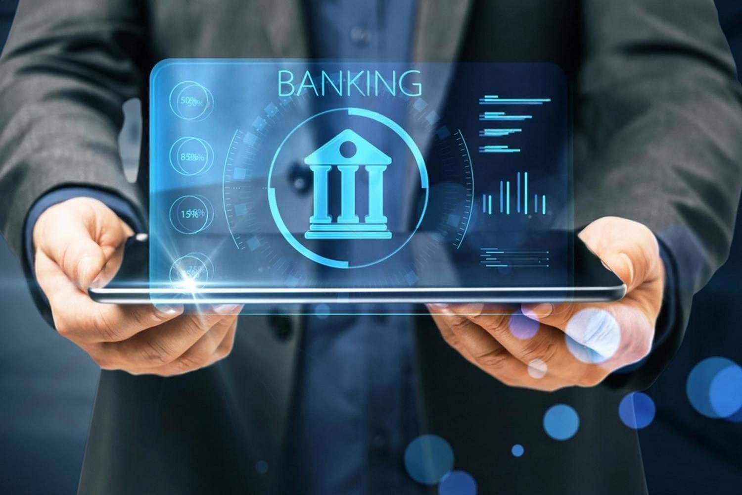 Businessman in a suit holding a tablet with a holographic banking interface showing cross-border metrics